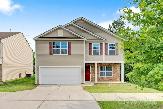 5311 Oakdale Ridge Rd, Charlotte, NC 28216 - view of front of house featuring a garage, a front yard, concrete driveway, stone siding, and central AC