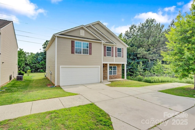 5311 Oakdale Ridge Rd, Charlotte, NC 28216 - view of front of house with a garage, concrete driveway, central AC, and a front lawn