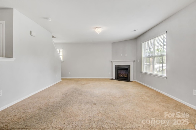 5311 Oakdale Ridge Rd, Charlotte, NC 28216 - unfurnished living room with carpet flooring, a fireplace with flush hearth, and baseboards