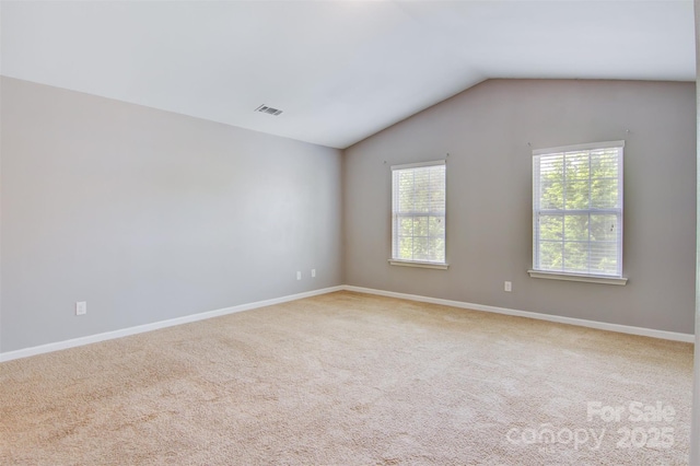 5311 Oakdale Ridge Rd, Charlotte, NC 28216 - carpeted empty room featuring lofted ceiling and baseboards