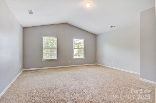5311 Oakdale Ridge Rd, Charlotte, NC 28216 - carpeted spare room featuring lofted ceiling and baseboards