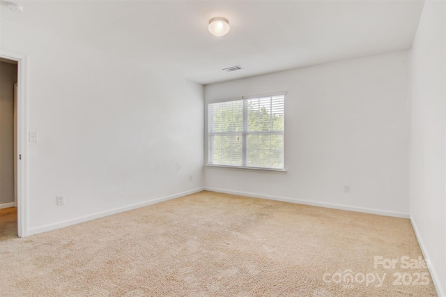 5311 Oakdale Ridge Rd, Charlotte, NC 28216 - carpeted empty room with baseboards and a smoke detector