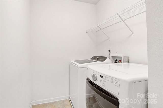5311 Oakdale Ridge Rd, Charlotte, NC 28216 - laundry area with independent washer and dryer and baseboards