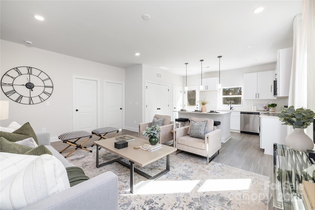 7805 Shadow Lawn Rd, Charlotte, NC 28269 - living area featuring light wood finished floors, recessed lighting, and baseboards