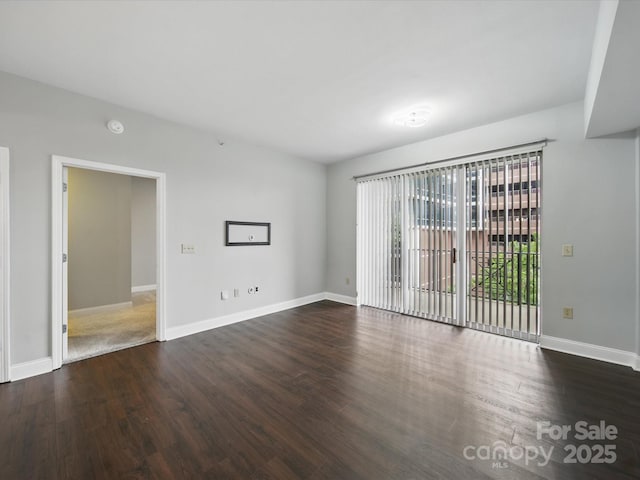 300 W 5th St Unit 339, Charlotte, NC 28202 - unfurnished room with dark wood-style flooring and baseboards