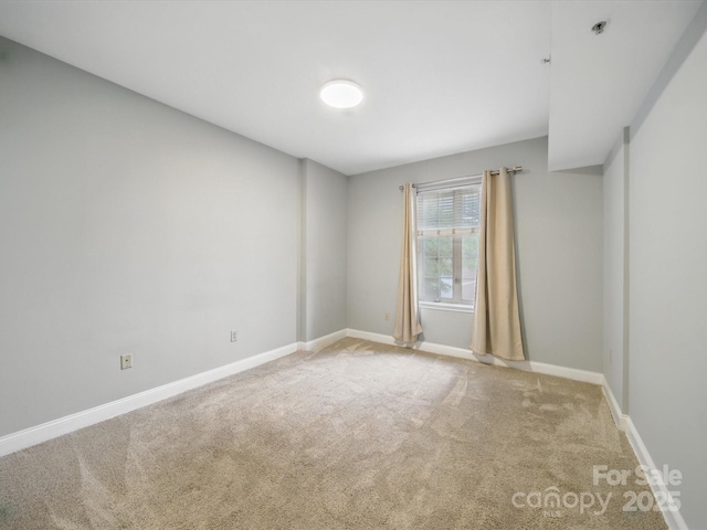 300 W 5th St Unit 339, Charlotte, NC 28202 - carpeted spare room featuring baseboards