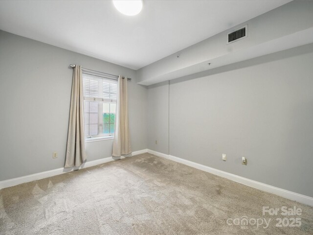 300 W 5th St Unit 339, Charlotte, NC 28202 - unfurnished room with carpet floors and baseboards