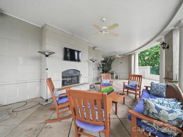 300 W 5th St Unit 339, Charlotte, NC 28202 - view of patio with an outdoor living space with a fireplace, a ceiling fan, and outdoor dining area