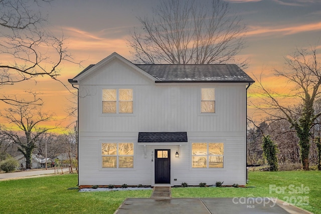 6327 Carver Blvd, Charlotte, NC 28269 - view of front facade with a shingled roof and a front lawn