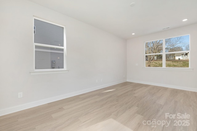 6327 Carver Blvd, Charlotte, NC 28269 - spare room with light wood-style flooring, baseboards, and recessed lighting