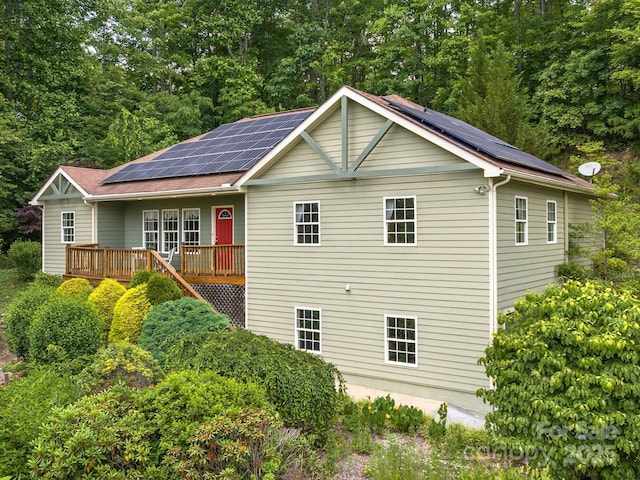 21 Kahluas Way, Fairview, NC 28730 - view of side of property with roof mounted solar panels and a wooden deck