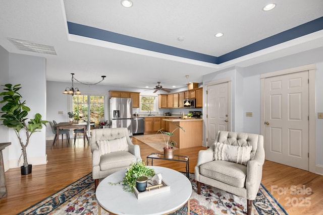 21 Kahluas Way, Fairview, NC 28730 - living area featuring light wood-style flooring, recessed lighting, a chandelier, and a ceiling fan