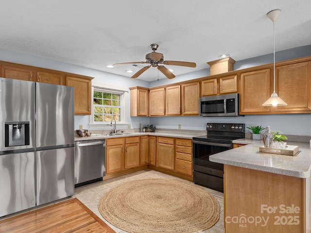 21 Kahluas Way, Fairview, NC 28730 - kitchen featuring stainless steel appliances, recessed lighting, light tile patterned floors, a ceiling fan, and pendant lighting