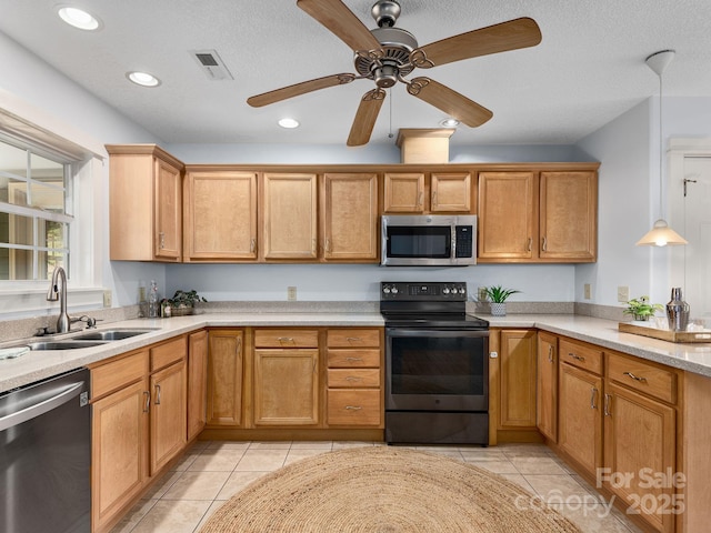21 Kahluas Way, Fairview, NC 28730 - kitchen with appliances with stainless steel finishes, light countertops, ceiling fan, light tile patterned floors, and recessed lighting