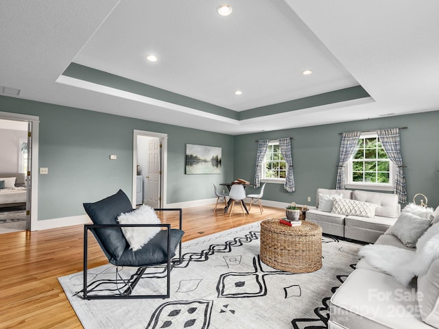 21 Kahluas Way, Fairview, NC 28730 - living room featuring a raised ceiling, wood finished floors, and recessed lighting
