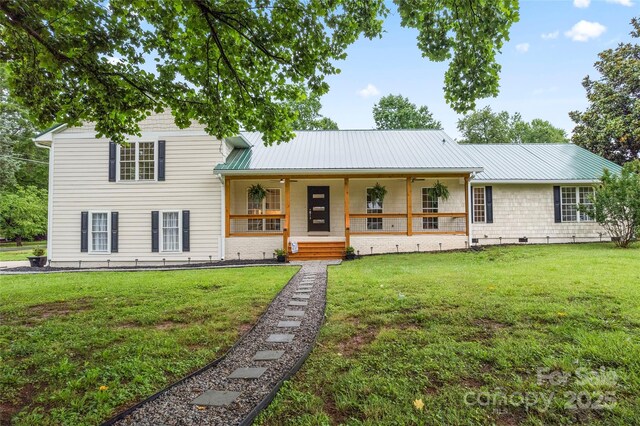 105 Pelican Ct, Mooresville, NC 28117 - view of front of house featuring metal roof, a front yard, a porch, and crawl space
