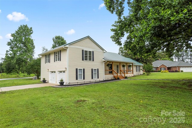 105 Pelican Ct, Mooresville, NC 28117 - view of front of property with driveway, a porch, an attached garage, and a front yard