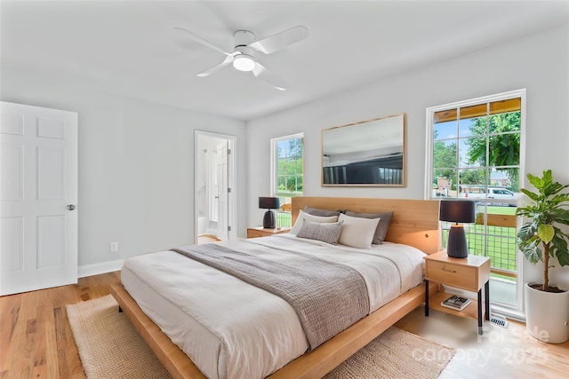 105 Pelican Ct, Mooresville, NC 28117 - bedroom featuring wood finished floors, a ceiling fan, ensuite bathroom, and baseboards