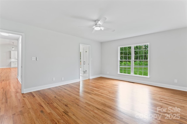 105 Pelican Ct, Mooresville, NC 28117 - spare room with a ceiling fan, light wood-style floors, and baseboards