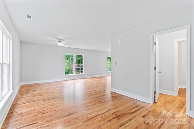 105 Pelican Ct, Mooresville, NC 28117 - spare room with a ceiling fan, light wood-type flooring, and baseboards