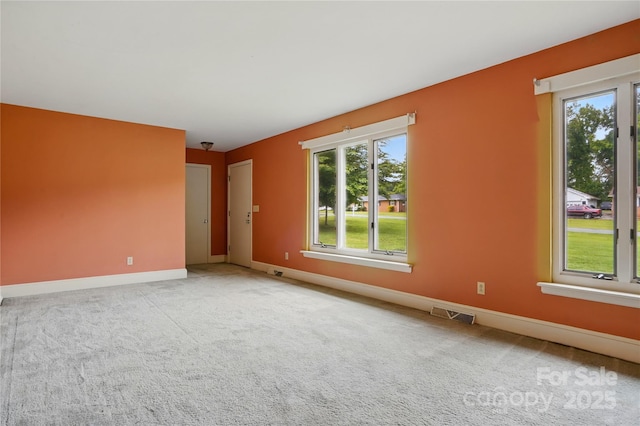 6900 Ridge Lane Rd, Charlotte, NC 28262 - carpeted spare room with plenty of natural light and baseboards