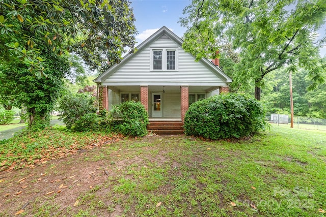 520 Eastwood Park Cir, Albemarle, NC 28001 - bungalow with covered porch, brick siding, and a chimney