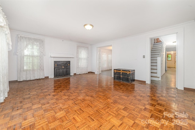 520 Eastwood Park Cir, Albemarle, NC 28001 - unfurnished living room featuring stairs, a fireplace with flush hearth, crown molding, and baseboards