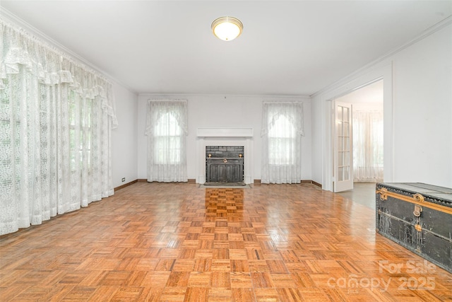 520 Eastwood Park Cir, Albemarle, NC 28001 - unfurnished living room featuring baseboards, a fireplace with flush hearth, and crown molding