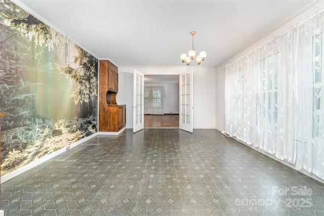 520 Eastwood Park Cir, Albemarle, NC 28001 - unfurnished living room with baseboards, a chandelier, and french doors