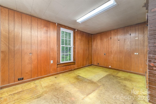 520 Eastwood Park Cir, Albemarle, NC 28001 - spare room featuring wooden walls and concrete flooring