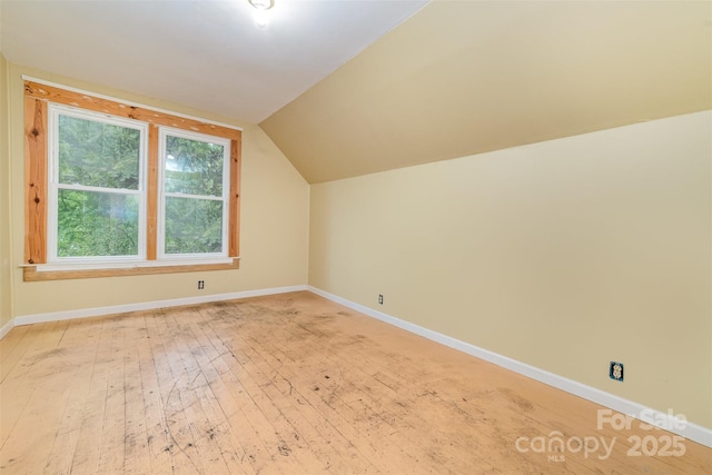 520 Eastwood Park Cir, Albemarle, NC 28001 - bonus room featuring baseboards, vaulted ceiling, and light wood finished floors