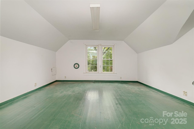 520 Eastwood Park Cir, Albemarle, NC 28001 - bonus room with baseboards, wood finished floors, and vaulted ceiling
