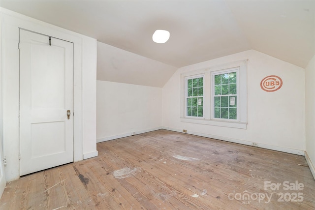 520 Eastwood Park Cir, Albemarle, NC 28001 - additional living space featuring hardwood / wood-style flooring, vaulted ceiling, and baseboards
