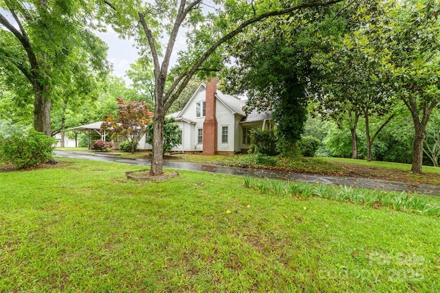 520 Eastwood Park Cir, Albemarle, NC 28001 - view of grassy yard with driveway and a carport