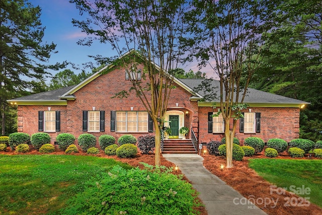 102 Rosewood Ln, Locust, NC 28097 - view of front facade featuring brick siding and a front lawn