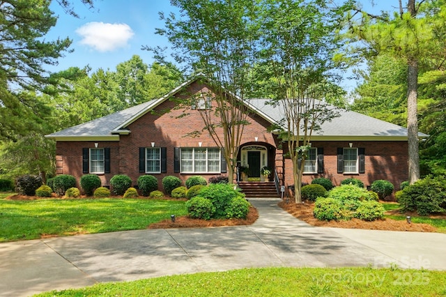 102 Rosewood Ln, Locust, NC 28097 - view of front of property with brick siding and a front yard