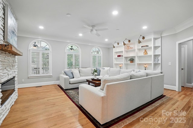 102 Rosewood Ln, Locust, NC 28097 - living room featuring ceiling fan, ornamental molding, a fireplace, light wood-type flooring, and recessed lighting