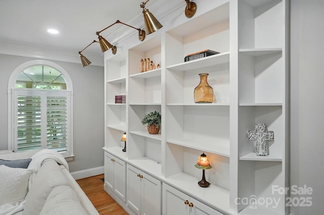 102 Rosewood Ln, Locust, NC 28097 - detailed view of wood finished floors, baseboards, and ornamental molding