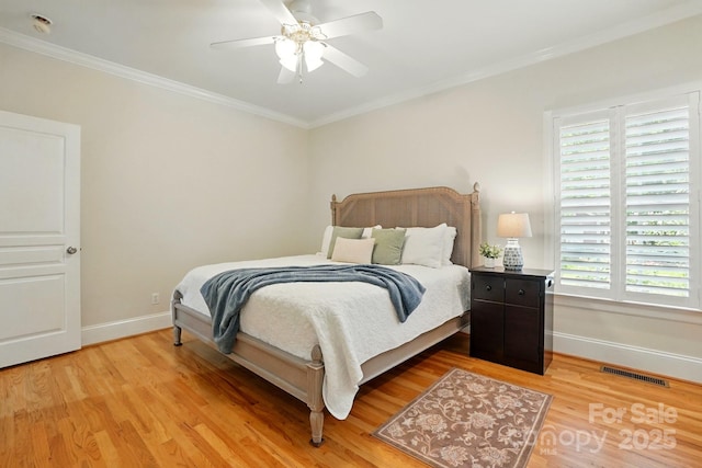 102 Rosewood Ln, Locust, NC 28097 - bedroom featuring baseboards, light wood-style floors, multiple windows, ornamental molding, and a ceiling fan