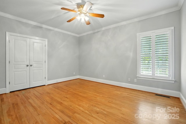 102 Rosewood Ln, Locust, NC 28097 - unfurnished bedroom featuring light wood-style flooring, crown molding, baseboards, and ceiling fan