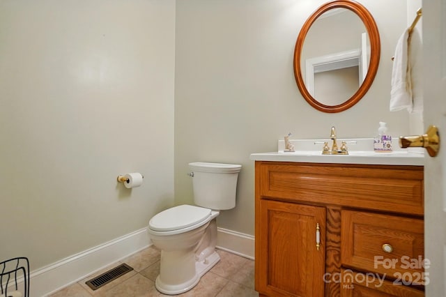 102 Rosewood Ln, Locust, NC 28097 - bathroom with toilet, tile patterned flooring, vanity, and baseboards