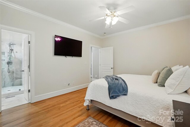 102 Rosewood Ln, Locust, NC 28097 - bedroom featuring ornamental molding, light wood finished floors, baseboards, ceiling fan, and ensuite bath