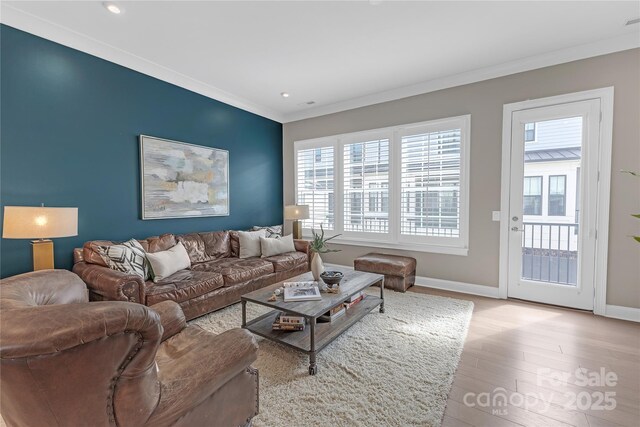 5060 Harrowsmith Ln, Charlotte, NC 28204 - living area with light wood-style floors, baseboards, crown molding, and recessed lighting
