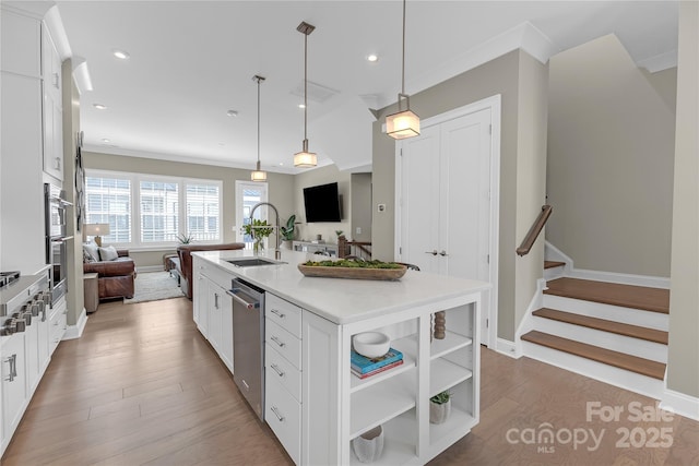 5060 Harrowsmith Ln, Charlotte, NC 28204 - kitchen with a sink, open floor plan, stainless steel dishwasher, white cabinets, and recessed lighting