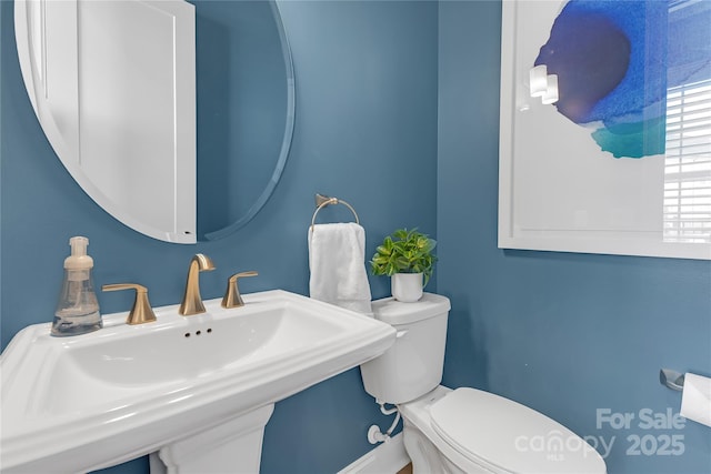 5060 Harrowsmith Ln, Charlotte, NC 28204 - half bathroom featuring toilet and a sink