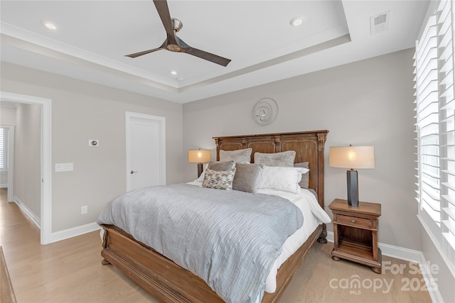 5060 Harrowsmith Ln, Charlotte, NC 28204 - bedroom with a tray ceiling, baseboards, light wood finished floors, a ceiling fan, and recessed lighting