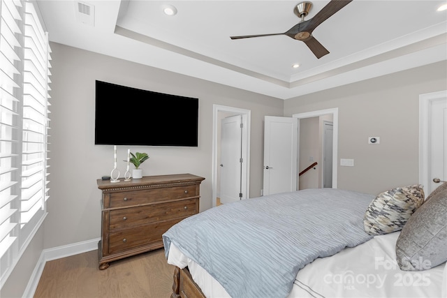 5060 Harrowsmith Ln, Charlotte, NC 28204 - bedroom featuring light wood-style floors, baseboards, recessed lighting, ceiling fan, and a tray ceiling