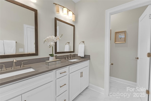 5060 Harrowsmith Ln, Charlotte, NC 28204 - full bath with marble look tile flooring, double vanity, and baseboards