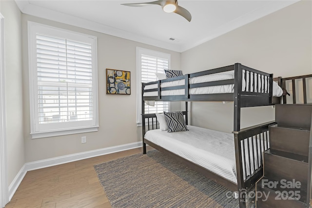5060 Harrowsmith Ln, Charlotte, NC 28204 - bedroom featuring wood finished floors, baseboards, and a ceiling fan