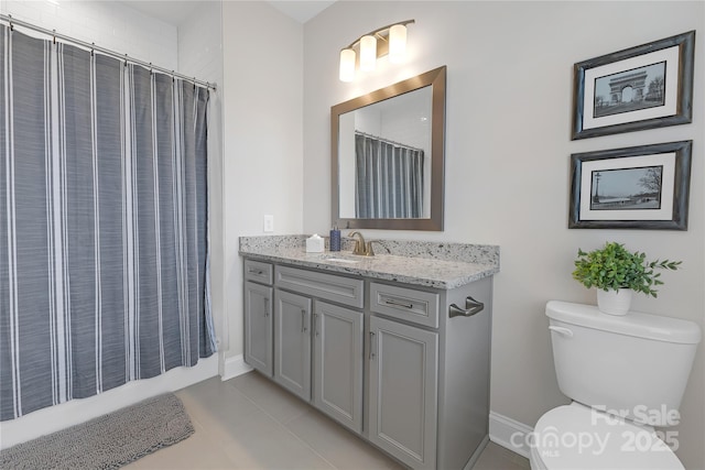 5060 Harrowsmith Ln, Charlotte, NC 28204 - bathroom featuring toilet, vanity, baseboards, and tile patterned flooring